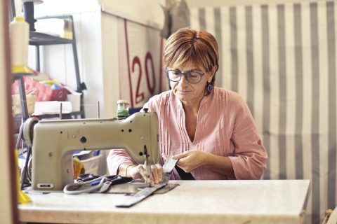 Photo of Woman Using Sewing Machine