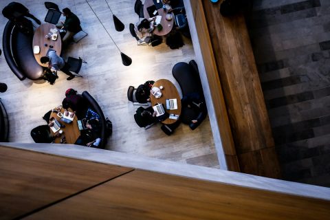 aerial photography of people sitting on chair